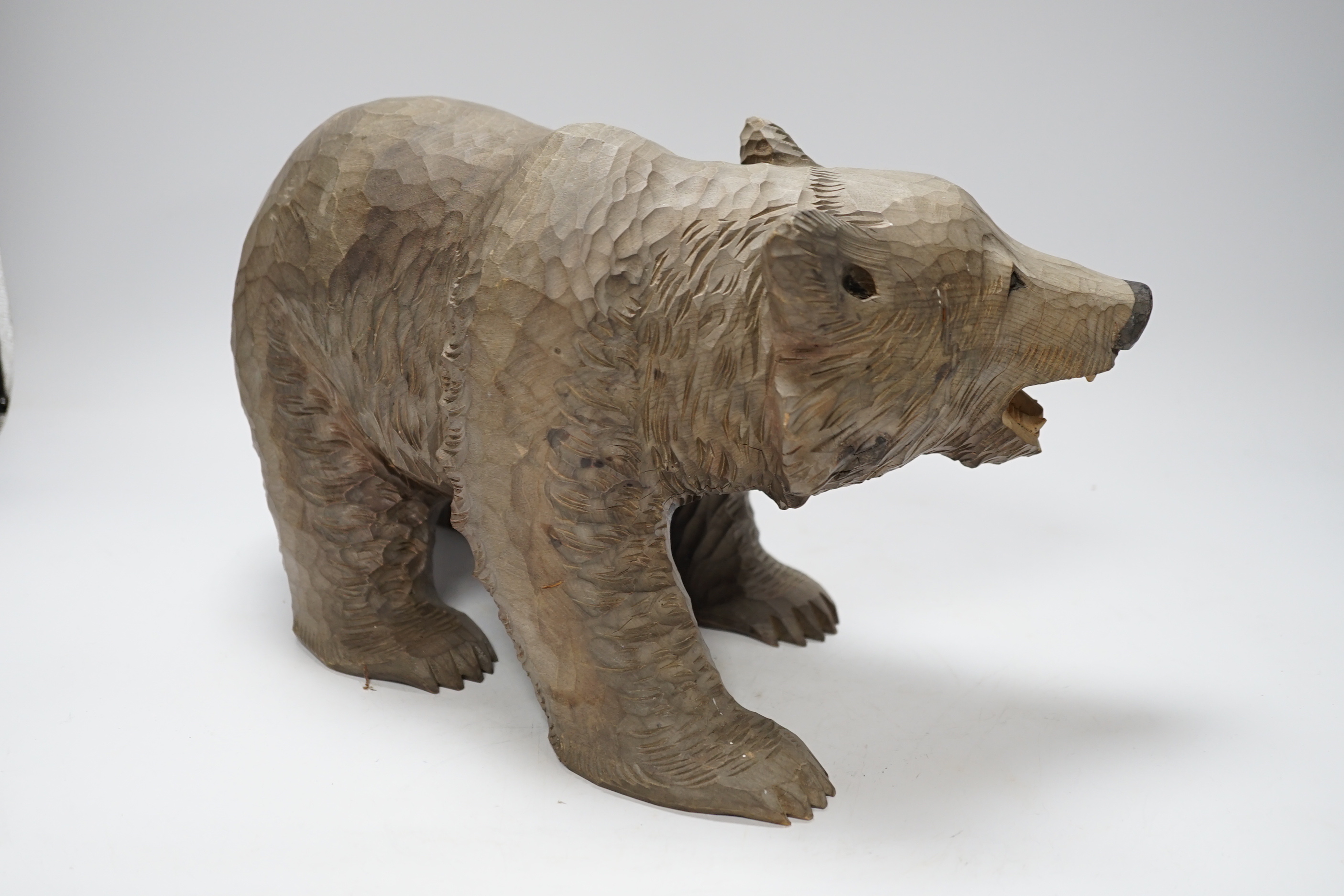 A Japanese carved wood bear, 32cm long